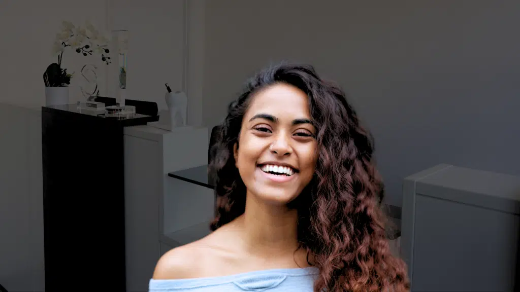A patient with a restores smile after laser-assisted periodontal gum treatment
