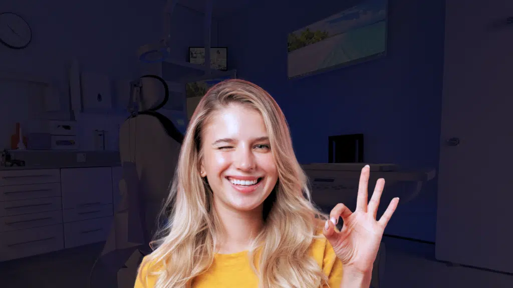 An overjoyed patient after periodontal splinting used to stabilise her deteriorating gums and smile.
